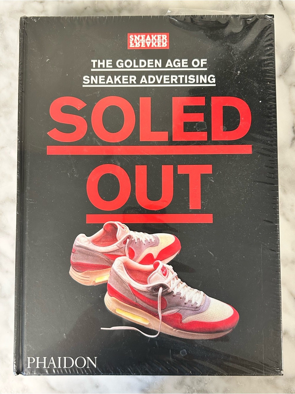 Hardcover Soled Out: The Golden Age of Sneaker Advertising • By: Phaidon